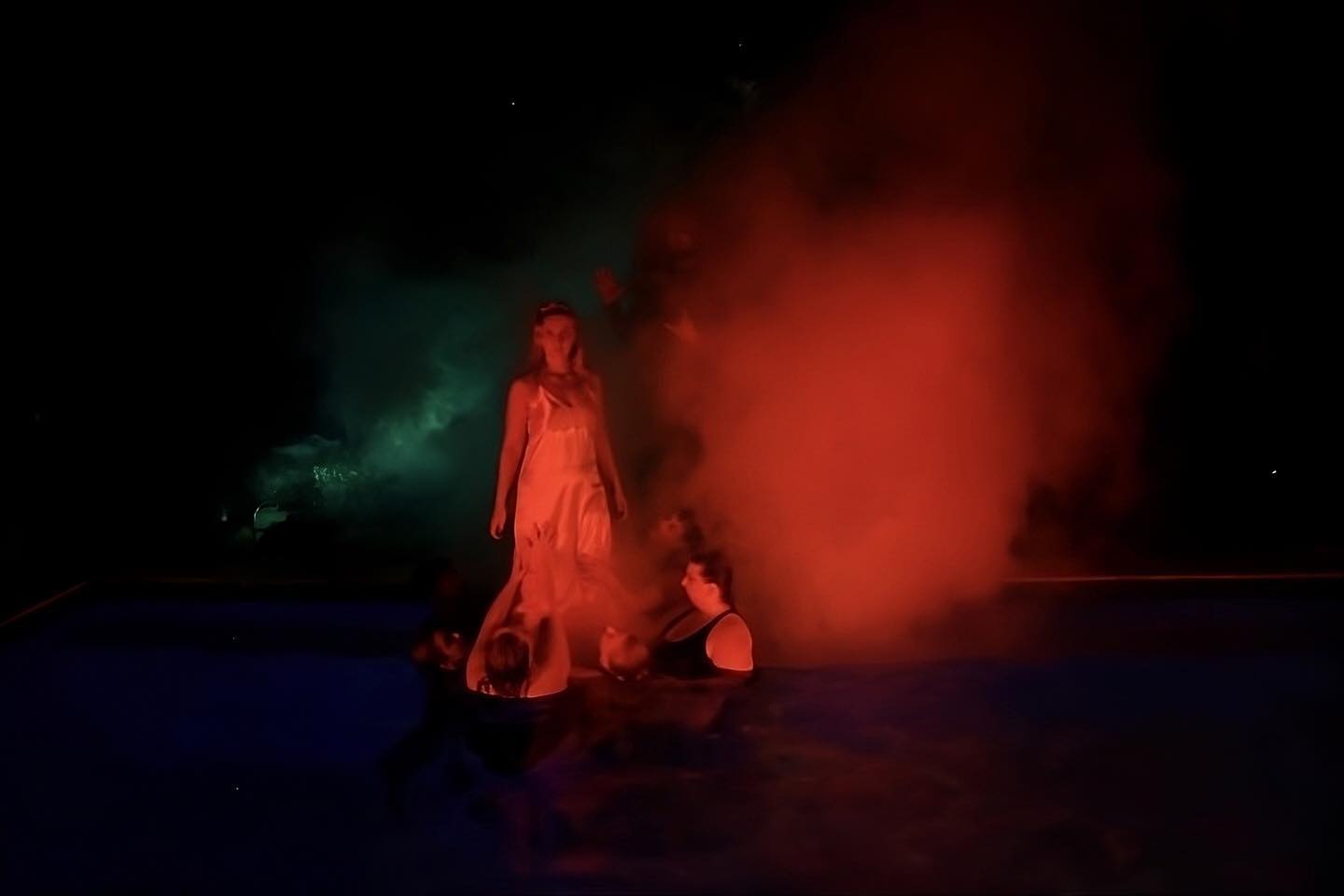 a vengance filled carrie emerging from a smoky pool
